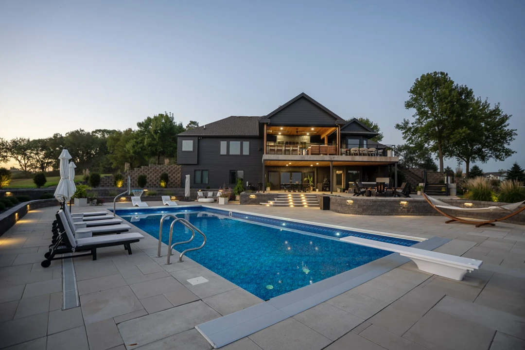 Luxury house with pool at sunset.